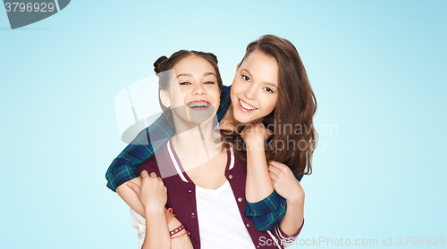 Image of happy smiling pretty teenage girls hugging