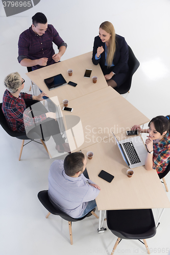 Image of aerial view of business people group on meeting