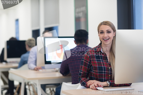 Image of startup business, woman  working on desktop computer