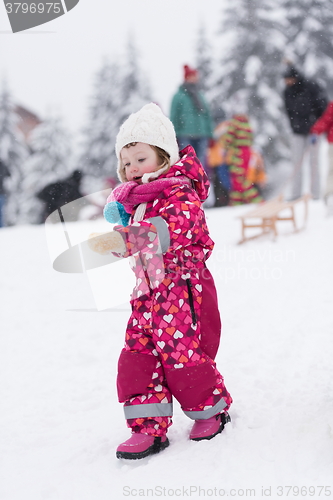 Image of little girl at snowy winter day