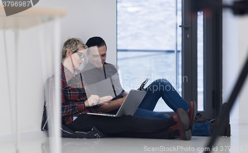 Image of startup business, couple working on laptop computer at office