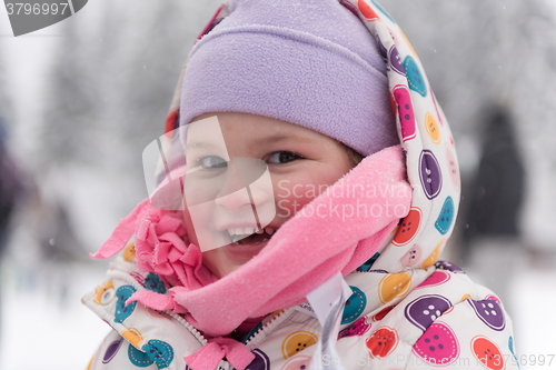 Image of little girl at snowy winter day