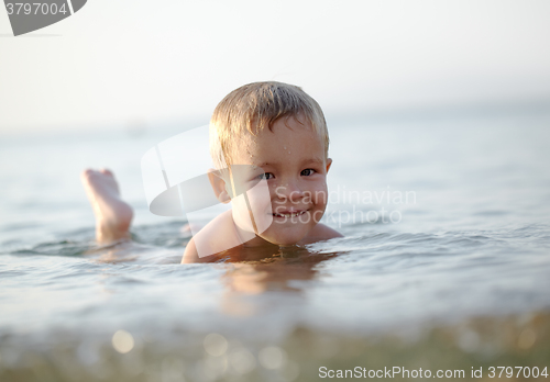 Image of Smiling little boy in the sea