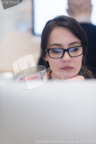 Image of startup business, woman  working on desktop computer