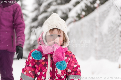 Image of little girl at snowy winter day