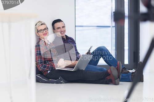 Image of startup business, couple working on laptop computer at office