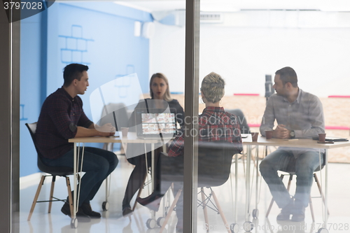 Image of startup business team on meeting at modern office