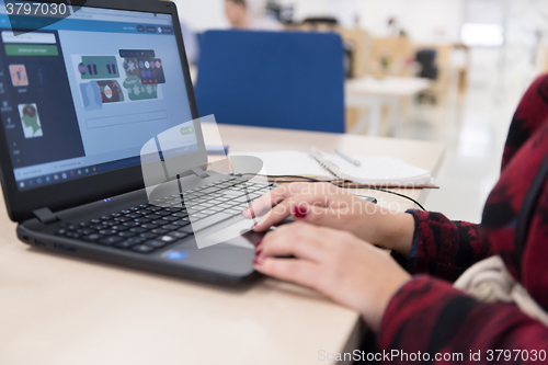 Image of startup business, woman  working on laptop