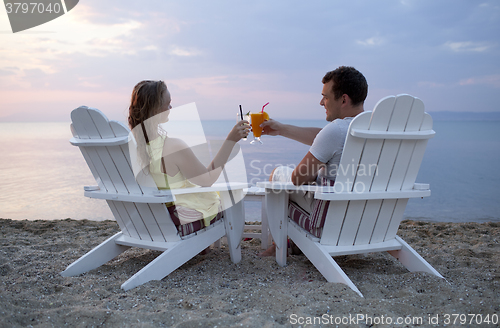 Image of Romantic couple toasting the sunset