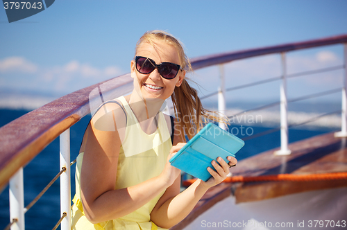 Image of Happy woman with pad during sea traveling