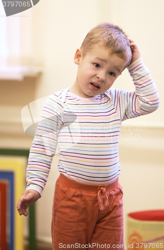 Image of Cute little boy with a puzzled expression
