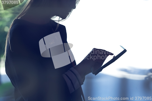 Image of Woman using tablet PC