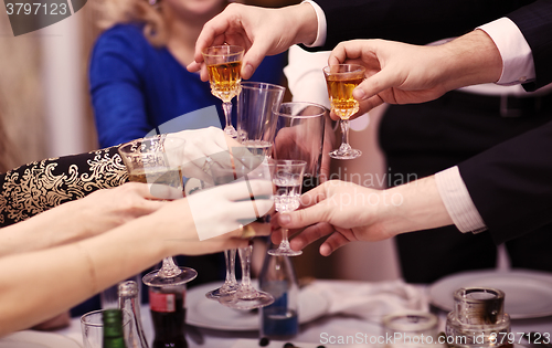 Image of Group of people toasting at a celebration