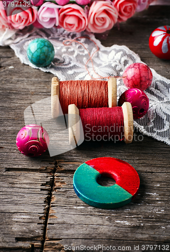 Image of Beads and spool of thread
