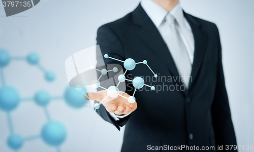 Image of close up of man showing molecule formula