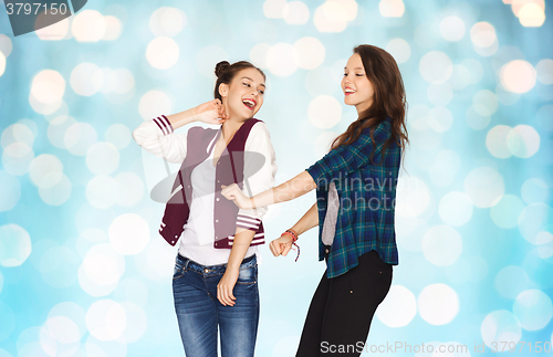 Image of happy smiling pretty teenage girls dancing