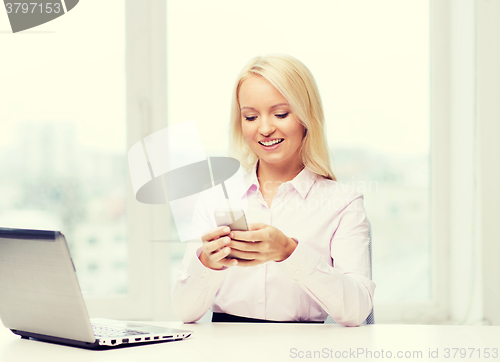 Image of smiling businesswoman or student with smartphone