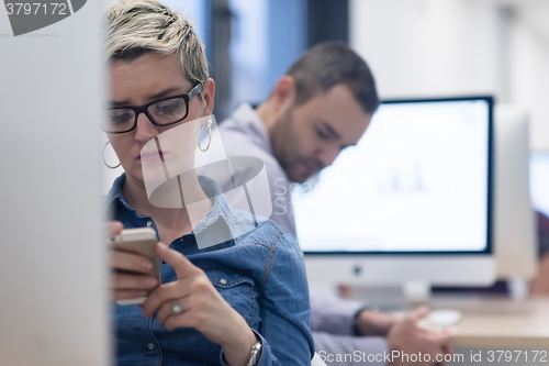 Image of startup business, woman  working on desktop computer