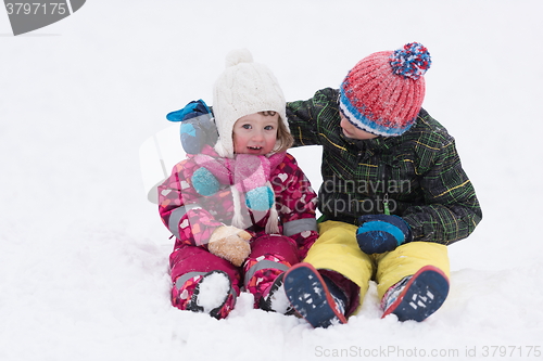 Image of group of kids having fun and play together in fresh snow