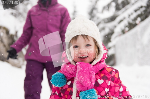 Image of little girl at snowy winter day