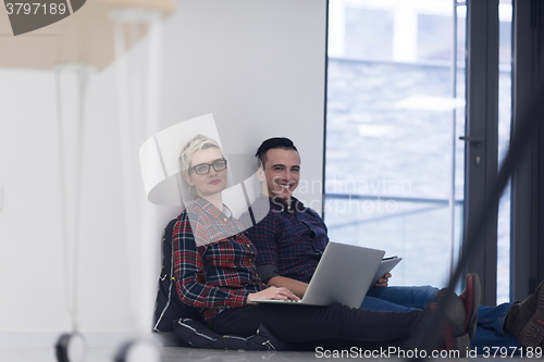 Image of startup business, couple working on laptop computer at office