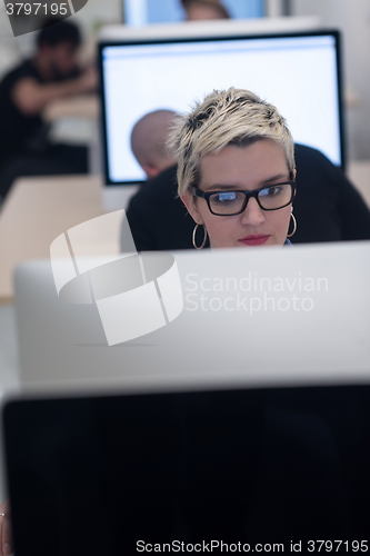 Image of startup business, woman  working on desktop computer