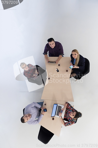 Image of aerial view of business people group on meeting