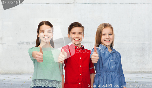 Image of happy children showing thumbs up