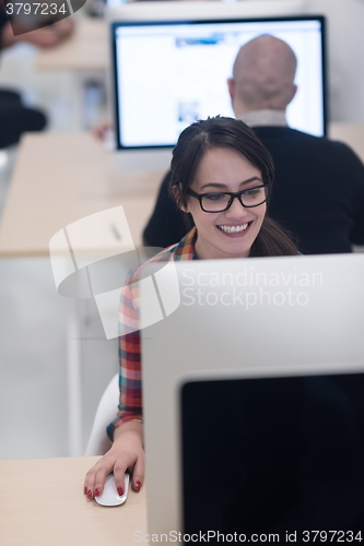 Image of startup business, woman  working on desktop computer