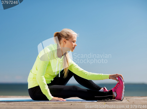 Image of woman doing sports outdoors