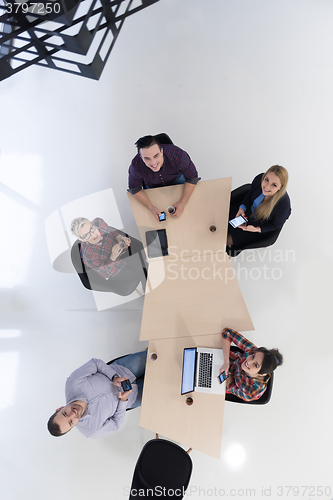 Image of aerial view of business people group on meeting