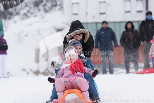 Image of group of kids having fun and play together in fresh snow