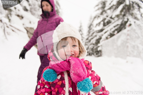 Image of little girl at snowy winter day