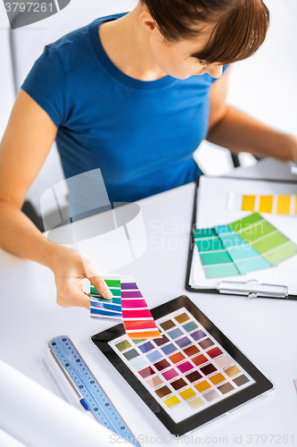 Image of woman working with color samples for selection