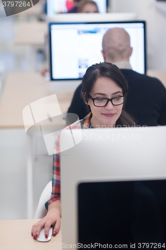 Image of startup business, woman  working on desktop computer