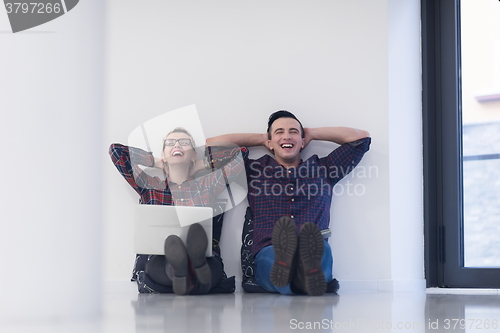 Image of startup business, couple working on laptop computer at office