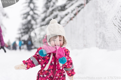 Image of little girl at snowy winter day