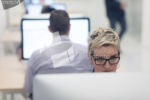 Image of startup business, woman  working on desktop computer