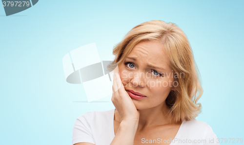 Image of unhappy woman suffering toothache