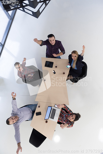 Image of aerial view of business people group on meeting