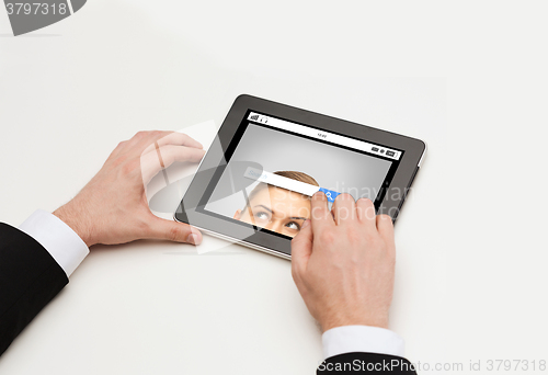 Image of close up of hands and internet search on tablet pc
