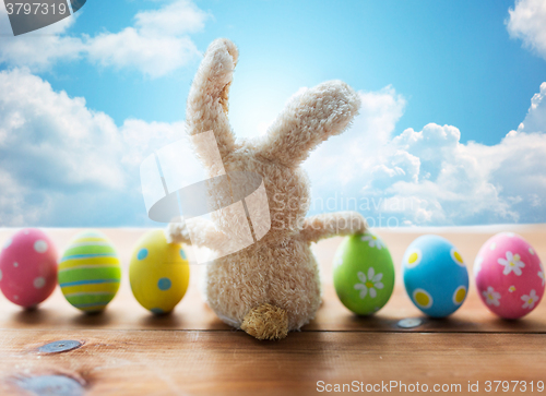 Image of close up of colored easter eggs and bunny