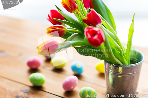 Image of close up of easter eggs and flowers in bucket