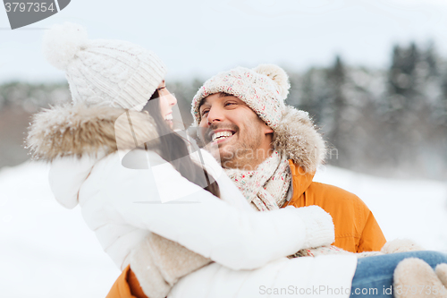 Image of happy couple outdoors in winter