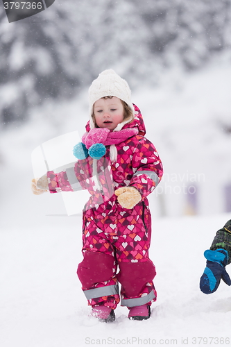 Image of little girl at snowy winter day