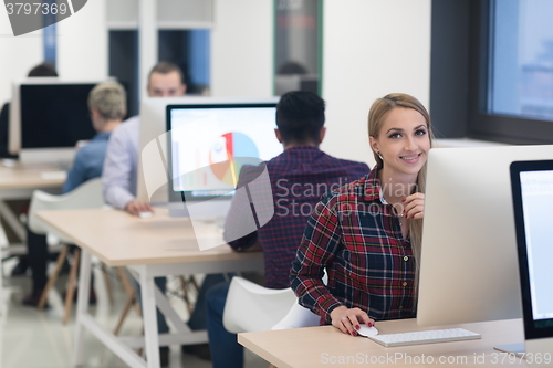 Image of startup business, woman  working on desktop computer