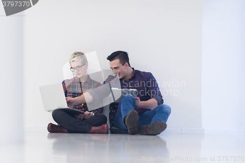 Image of startup business, couple working on laptop computer at office