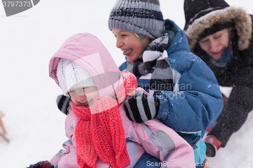 Image of group of kids having fun and play together in fresh snow