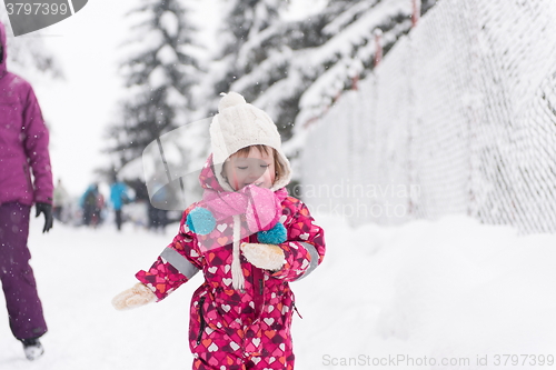 Image of little girl at snowy winter day