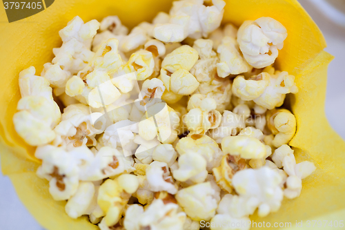 Image of Tasty popcorn in yellow paper bag